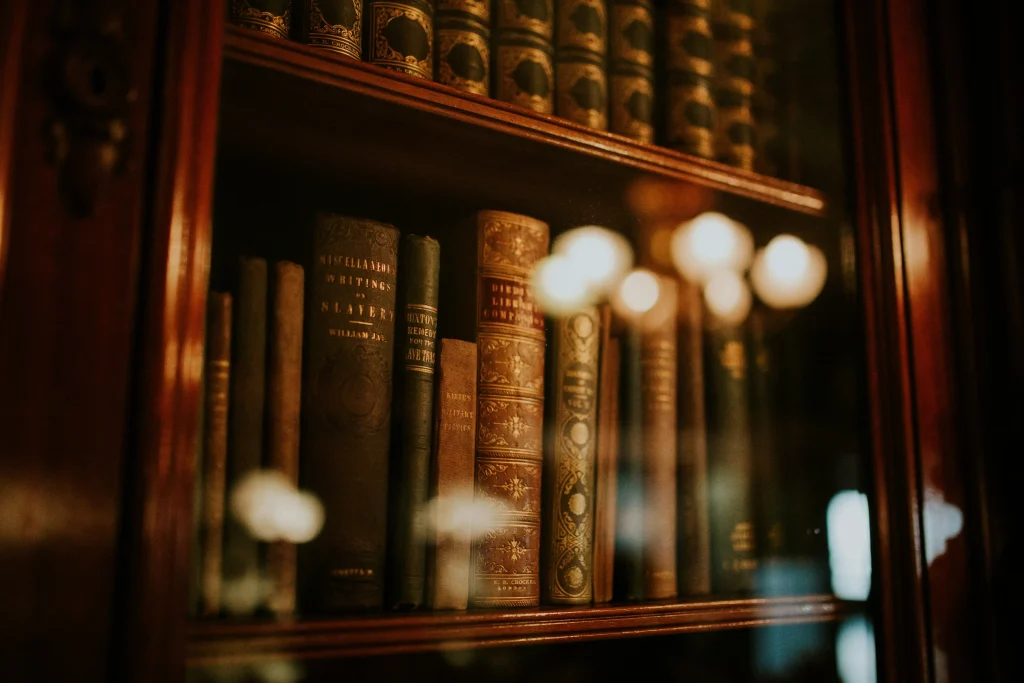 A close-up of classic legal books in a cabinet, representing knowledge and legal history.