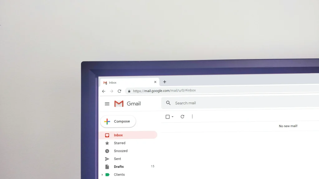 The image shows a Gmail inbox screen on a computer, with no new emails and 15 drafts saved.