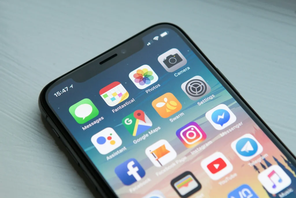 Close-up of a smartphone screen showing various app icons.